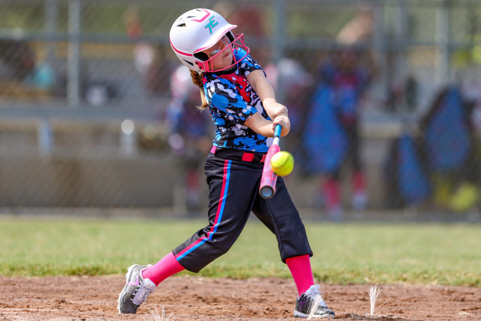 Premium Photo  Portrait of young girl on baseball field with bat ready to  hit the ball team player with paint on her face to show focus determination  and motivation for success and win in sports game